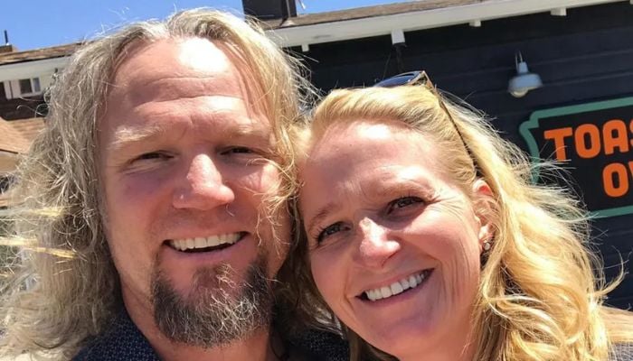 Christine Brown and her ex-husband are smiling for a picture