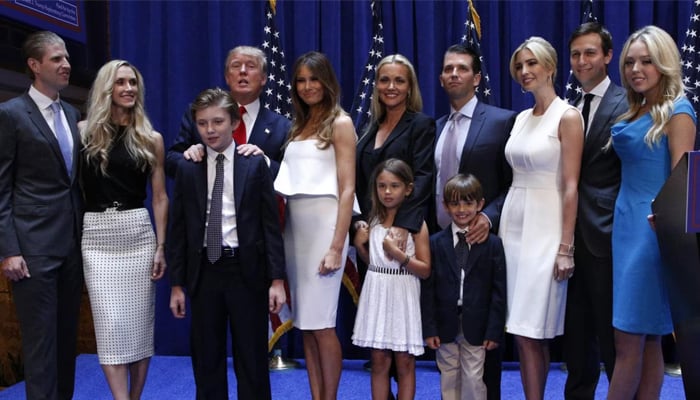 Republican presidential candidate, real estate mogul and TV personality Donald Trump poses with his family after formally announcing his campaign for the 2016 Republican presidential nomination during an event at Trump Tower in New York June 16, 2015. — Reuters