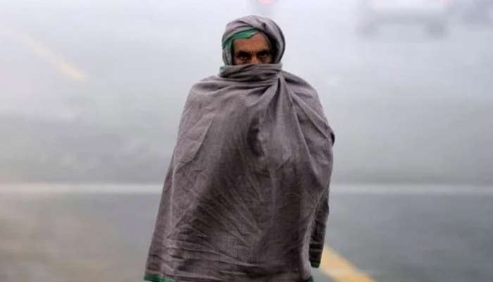 A representational image of a man wearing a shawl on a cold day. — Reuters/File