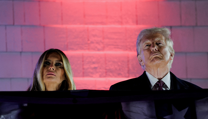 US President-elect Donald Trump (R) and his wife, Melania Trump, view fireworks at Trump National Golf Club Washington DC in Sterling, Virginia, US on January 18, 2025. — Reuters