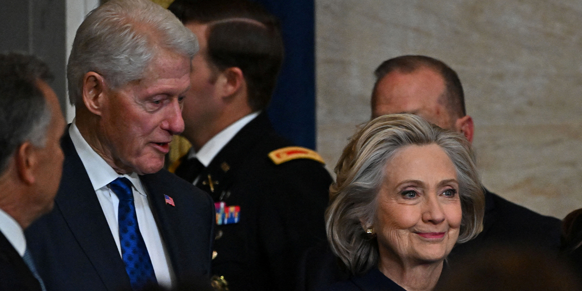 Former president Bill Clinton (L) pictured with wife Hillary Cinton in the Rotunda of the US Capitol on January 20, 2025 in Washington, DC. — Reuters