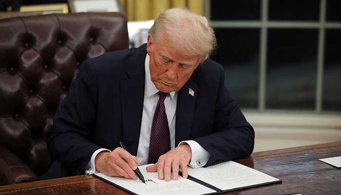 US President Donald Trump signs documents as he issues executive orders and pardons for January 6 defendants in the Oval Office at the White House on Inauguration Day in Washington, US, January 20, 2025. — Reuters