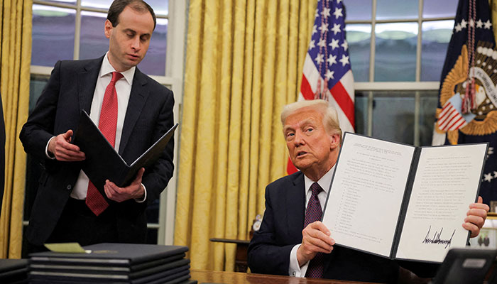 US President Donald Trump shows his signature on an executive order that he signed in front of supporters inside the Capital One Arena during ceremonies on the inauguration day of his second presidential term, in Washington, US January 20, 2025. — Reuters
