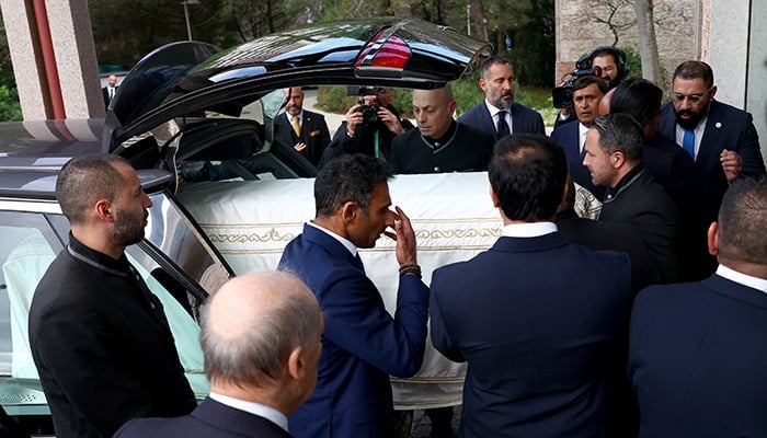 A coffin of Prince Karim Al-Hussaini Aga Khan IV, the spiritual leader of Ismaili Muslims, is carried into the hearse from the Ismaili Centre during his funeral in Lisbon, Portugal, February 8, 2025. — Reuters