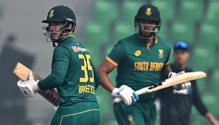 South Africas Matthew Breetzke (left) and Jason Smith run between the wickets during the Tri-Nation Series second ODI match between New Zealand and South Africa at the Gaddafi Stadium in Lahore on February 10, 2025. — AFP