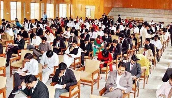 This picture shows applicants appearing in an exam. — APP/File