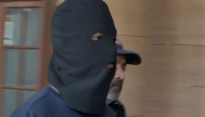 Police escort Armughan, prime suspect in Mustafa Amir murder case during an appearance before SHC on February 18, 2025. — Reporter