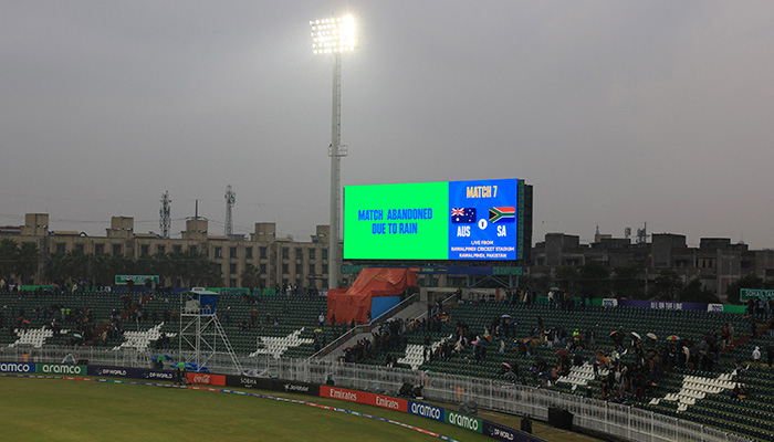 General view inside the Rawalpindi Cricket Stadium as a big screen displays a message confirming the match has been abandoned due to rain. — Reuters
