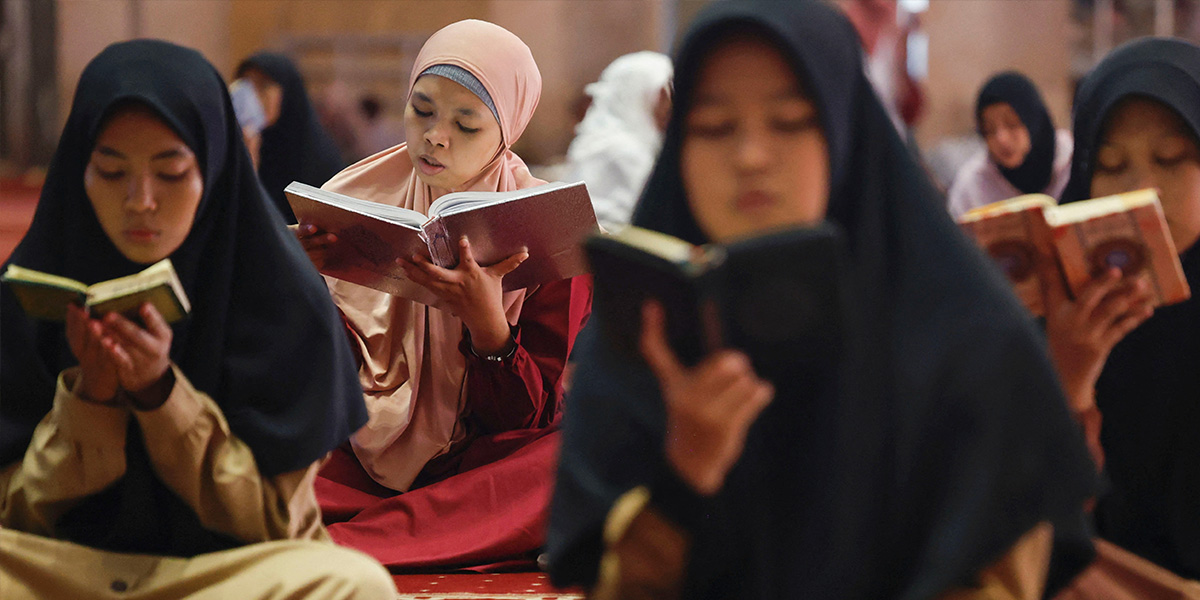 Indonesian women recite from the Holy Quran at Grand Mosque of Istiqlal in Jakarta, Indonesia, March 1, 2025. — Reuters