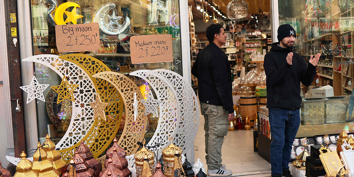 A man watches as people participate in a Ramadan parade on Fifth Avenue in the Bay Ridge neighbourhood on February 28, 2025 in the Brooklyn borough in New York City. — AFP