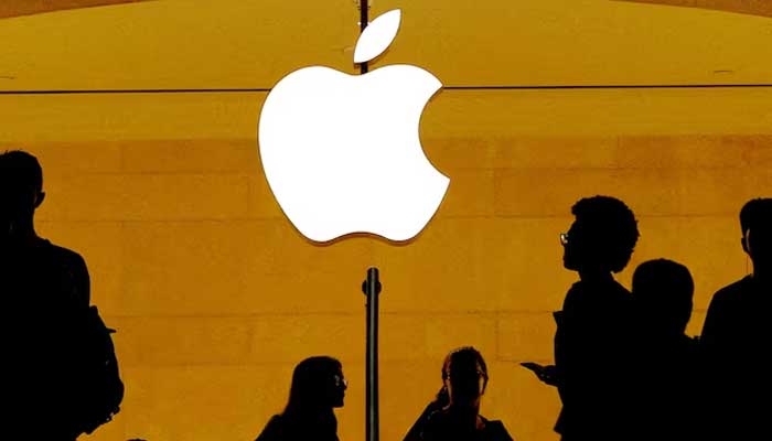 Customers walk past an Apple logo inside of an Apple store at Grand Central Station in New York, US, August 1, 2018. — Reuters