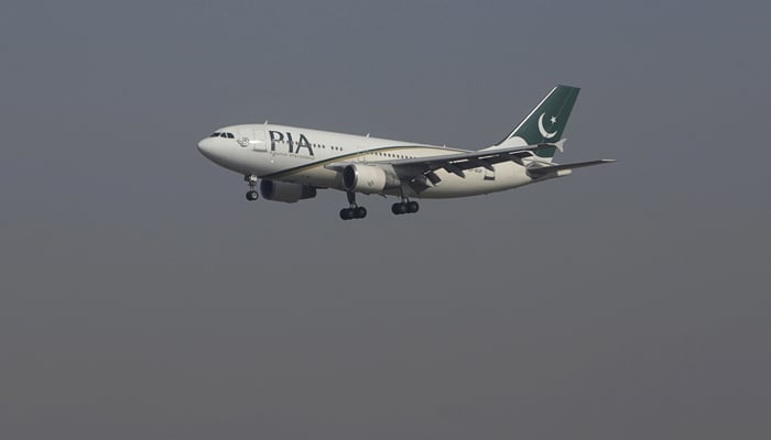 A Pakistan International Airlines passenger plane arrives at the Benazir International airport in Islamabad,, December 2, 2015. — Reuters