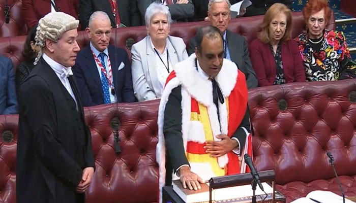 Lord Shaffaq Mohammed took oath on the Holy Quran in the House of Lords last week. — Reporter