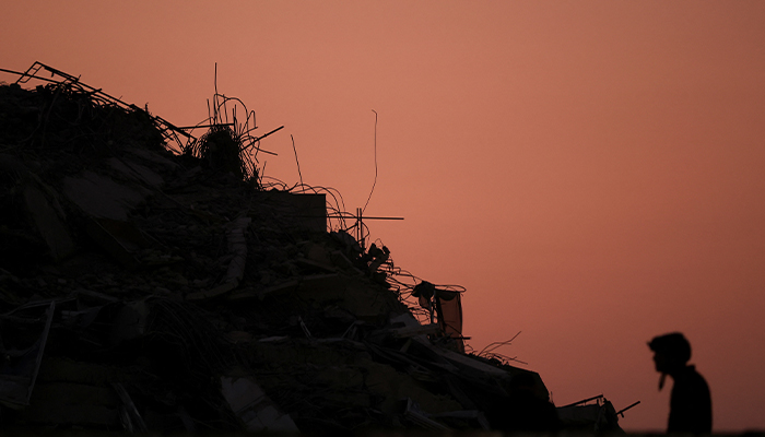 A person stands near rubble at the site of a building that collapsed, following a strong earthquake, in Bangkok, Thailand, March 29, 2025. — Reuters