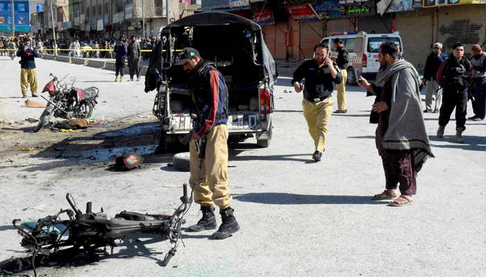 Security personnel inspect the site after militants detonated an explosive-laden motorbike along a road in Quetta on March 27, 2025. — AFP