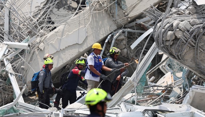 Rescue personnel work at the site of a building that collapsed, following a strong earthquake, in Bangkok, Thailand, on March 29, 2025. — Reuters