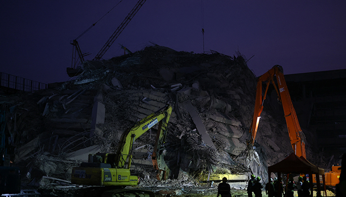 Rescue workers use heavy machinery to search for survivors at a collapsed building, following a strong earthquake, in Bangkok, Thailand, March 29, 2025. — Reuters