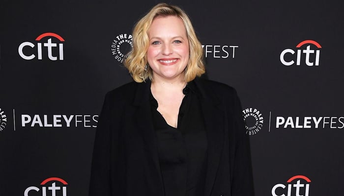 Elisabeth Moss celebrates motherhood with rare move