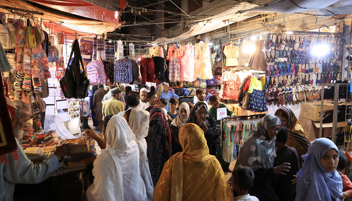 People shop in the market, ahead of Eid ul Fitr celebrations in Karachi, Pakistan, March 29, 2025. — Reuters