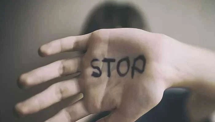 Representational image of a girl highlighting resistance against sexual abuse with stop written on her hand. — Unsplash/File