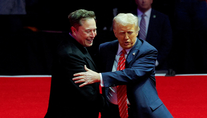 US President-elect Donald Trump greets Tesla CEO and X owner Elon Musk during a rally the day before Trump is scheduled to be inaugurated for a second term, in Washington, US, January 19, 2025.