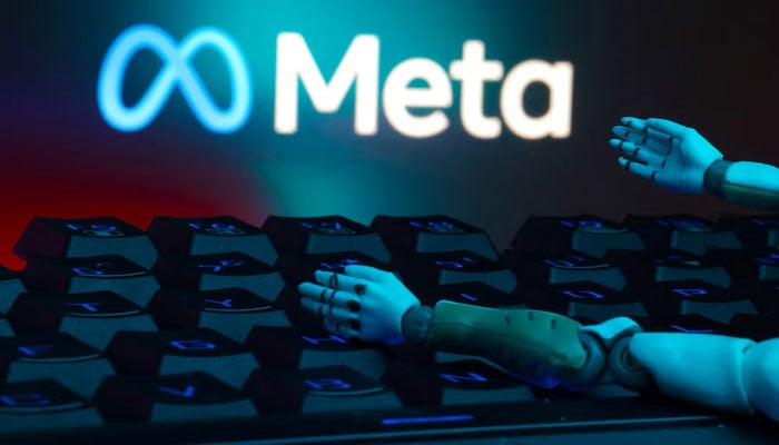 The Meta logo, a keyboard, and robot hands are seen in this illustration taken January 27, 2025. — Reuters