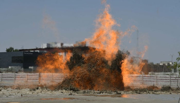 Smoke and flames rise after massive fire near an oil refinery in Karachis Korangi area on March 29, 2025.  — Online