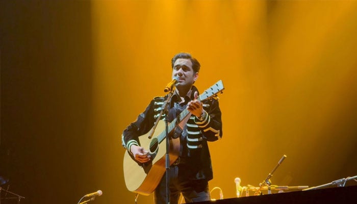 Rising music sensation Ammar Baig sings for the legendary Ustad Rahat Fateh Ali Khan during the Legacy of the Khans 2025 Tour, London. — Reporter