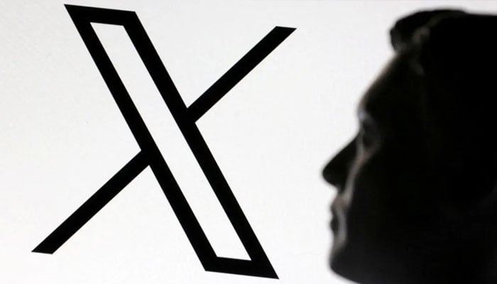 X owner Elon Musk seen with an X logo.— Reuters/File