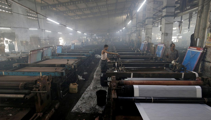 Workers of a textile mill work in this undated image. — Reuters