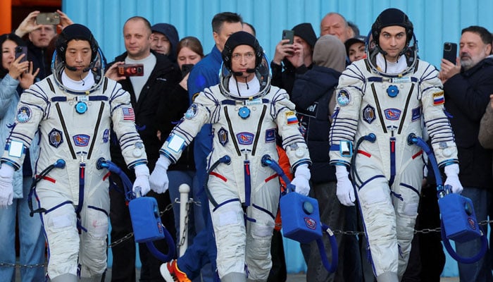 Crew members Roscosmos cosmonauts Commander Sergey Ryzhikov (C), Flight Engineer Alexey Zubritsky (R), and NASA astronaut Flight Engineer Jonny Kim (L) attend a send-off ceremony before the launch of the Soyuz MS-27 spacecraft at the Baikonur cosmodrome in Kazakhstan, 08 April 2025. — Reuters