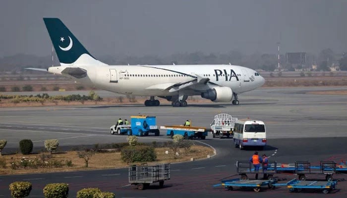 A Pakistan International Airlines (PIA) plane prepares to take-off at Alama Iqbal International Airport in Lahore. — Reuters/File