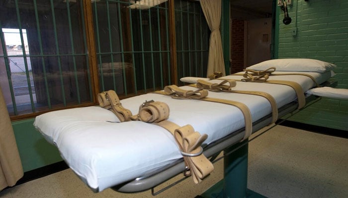 The death chamber and the steel bars of the viewing room are seen at the state penitentiary in Huntsville, Texas, US on September 29, 2010. — Reuters