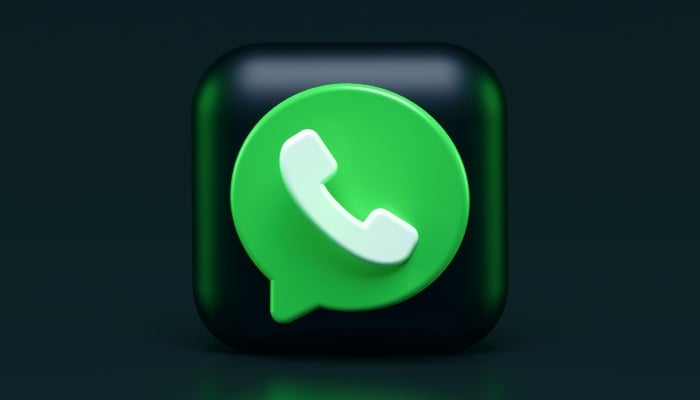 This representational image shows an illustration of the WhatsApp logo. — Unsplash
