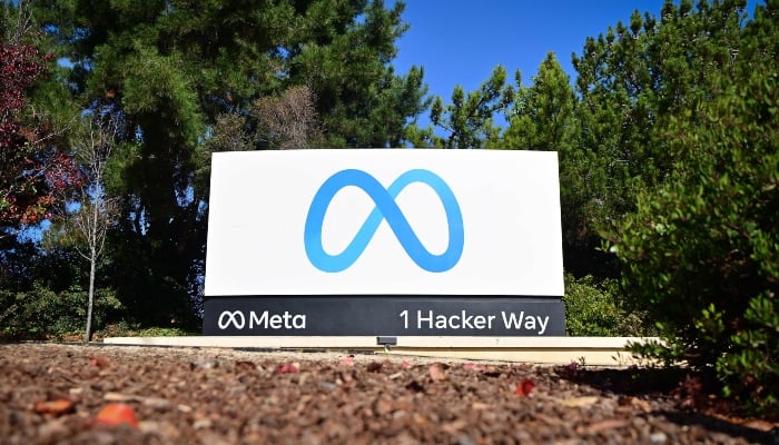The Meta logo marks the entrance of their corporate headquarters in Menlo Park, California, on November 09, 2022. — AFP