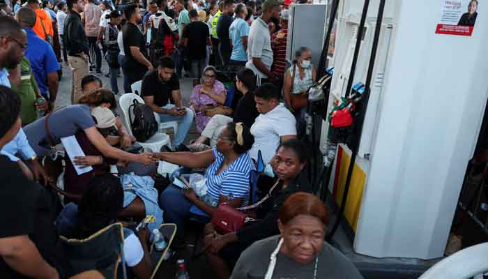 Death toll nears 200 in Dominican Republic nightclub tragedy 1 People gather at a gas station near the site of the collapsed Jet Set nightclub as they wait for news of relatives and friends in Santo Domingo, Dominican Republic, April 9, 2025. — Reuters