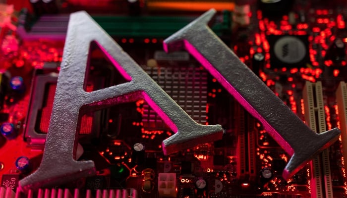 AI (Artificial Intelligence) letters are placed on a computer motherboard in this illustration taken, June 23, 2023. — Reuters