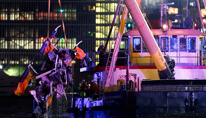 Emergency personnel work at the scene of a helicopter crash on the Hudson River near lower Manhattan in New York, as seen from Newport, New Jersey US, April 10, 2025. — Reuters