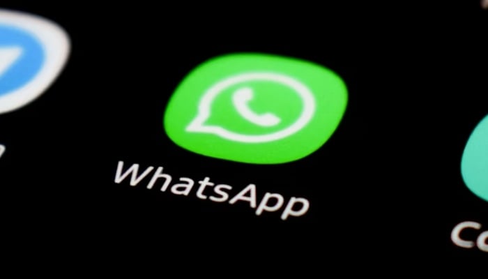 This representational image shows the WhatsApp icon displayed on a phone screen. — Unsplash