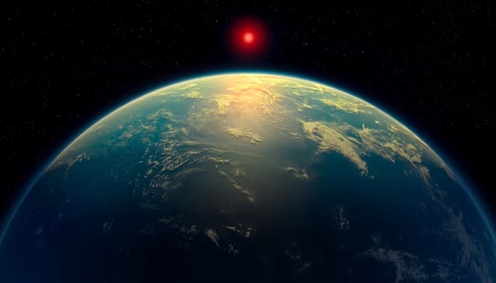 An illustration shows a hycean world — an exoplanet with a liquid water ocean beneath a hydrogen-rich atmosphere — orbiting a red dwarf star. This illustration was obtained by Reuters on April 16, 2025. —Reuters