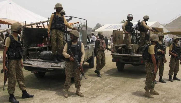 Pakistan Army soldiers stand guard in Bannu, Khyber Pakhtunkhwa, on July 2, 2014. — Reuters