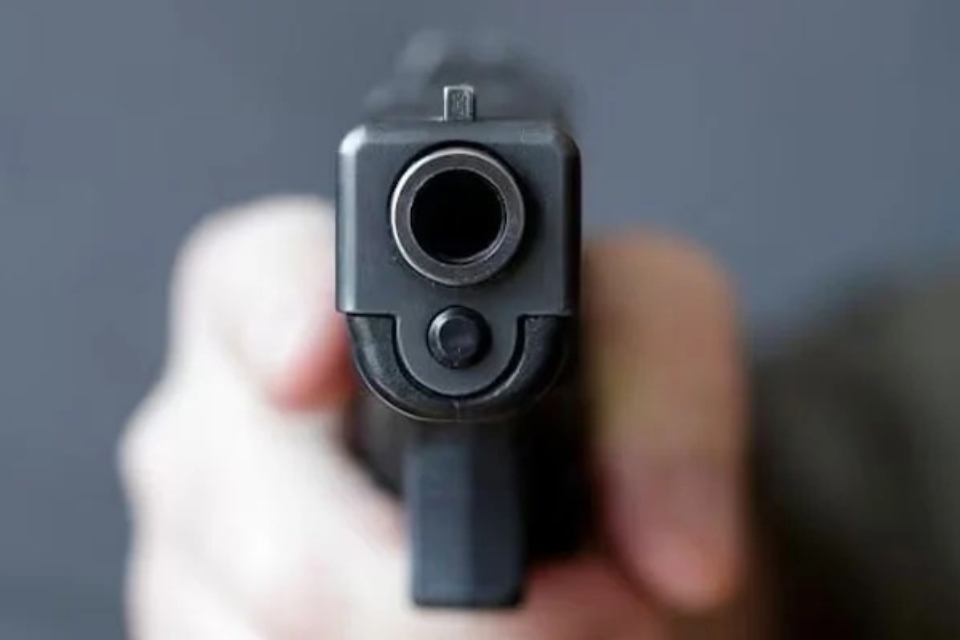 The representational image shows a person firing a bullet from a gun. — Reuters/File