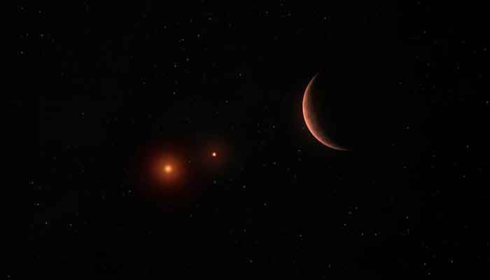 An illustration shows an exoplanet orbiting around two brown dwarfs - objects bigger than gas-giant planets but too small to be proper stars. — Reuters/File