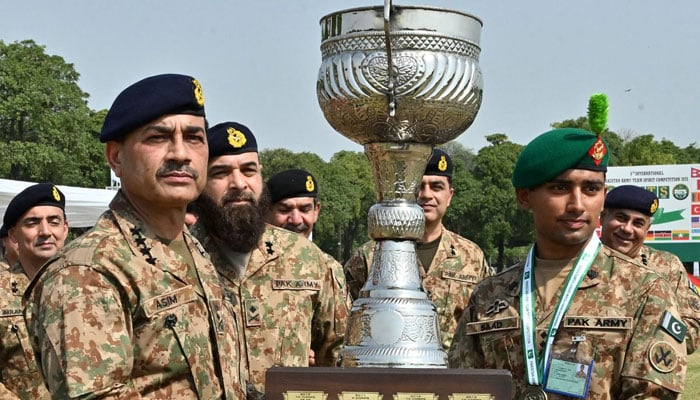 COAS General Asim Munir presents a trophy to a Pakistan Army soldier during the PATS 2025 on April 19, 2025. — ISPR
