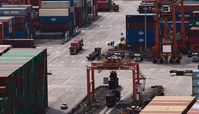 A truck carrying containers moves at the Yantian port in Shenzhen, Guangdong province, China April 17, 2025. — Reuters