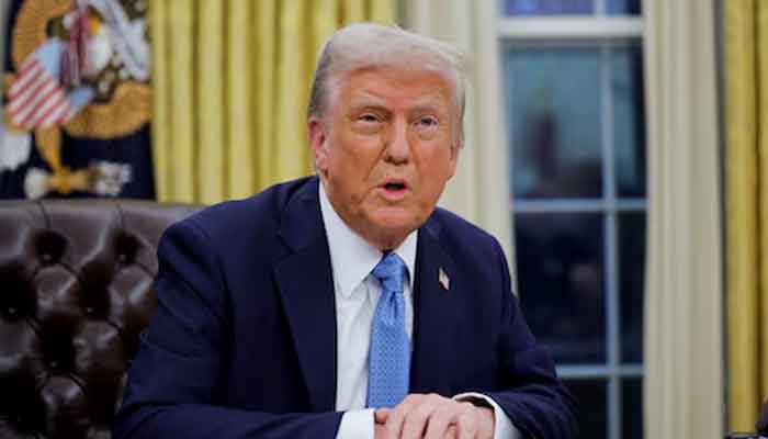 US President Donald Trump looks on as he signs an executive order in the Oval Office at the White House in Washington, US, January 31, 2025. — Reuters