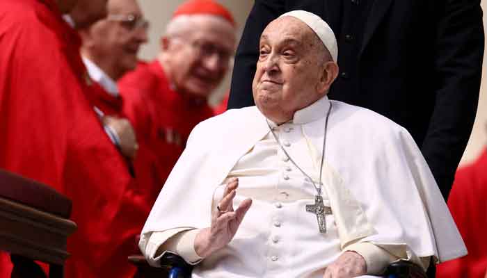 Pope Francis greets cardinals as he unexpectedly appears during the Palm Sunday Mass in Saint Peters Square at the Vatican, April 13, 2025. — Reuters