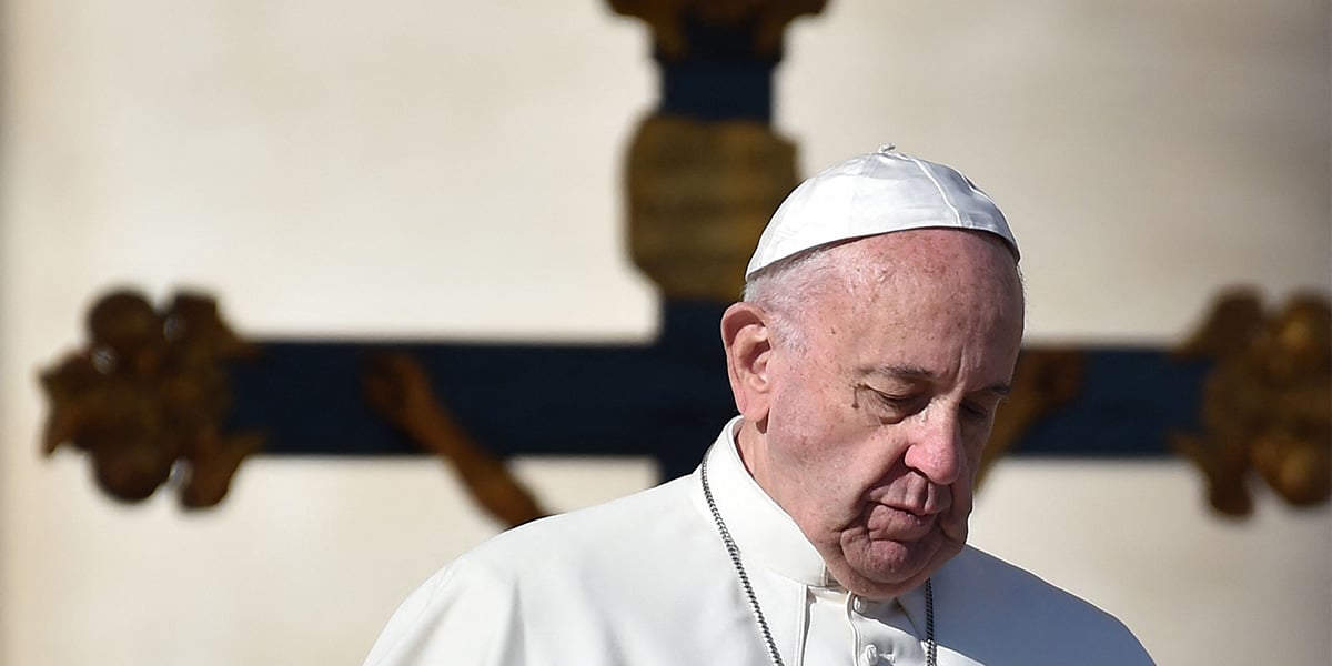 Pope Francis walks past a crucifix, during a weekly general audience at St Peters square in Vatican on November 16, 2016. — AFP