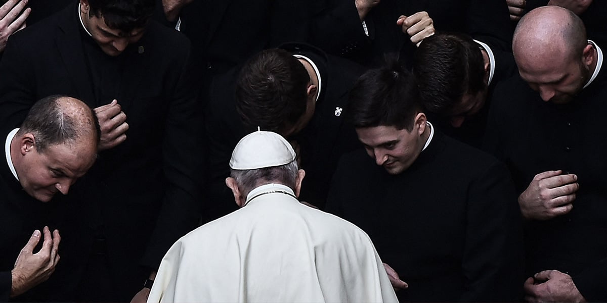 Pope Francis prays with priests at the end of a limited public audience at the San Damaso courtyard in The Vatican on September 30, 2020. — AFP