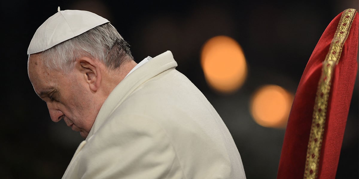 Pope Francis attends the celebration of the Way of the Cross on Good Friday at the Colosseum in Rome on March 29, 2013. — AFP